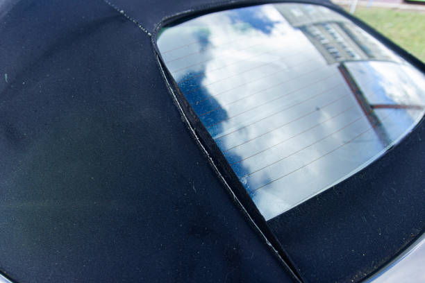 istock Convertible fabric roof repair, torn material, rubber seals. 1212211483