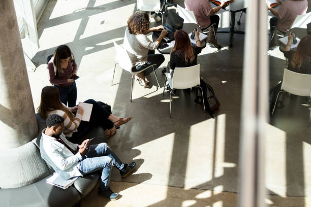 istock High angle view of college students studying in common area 1212211527