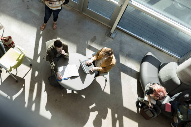istock High angle view of college students in campus common area 1212211564