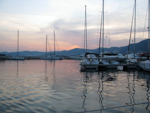 istock Yachts without sails in the marina at sunset. 1212211710