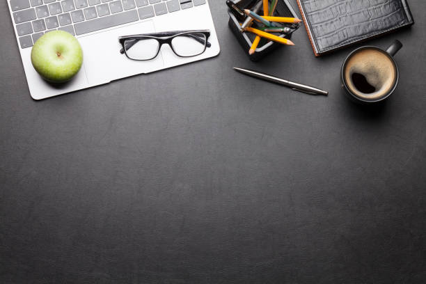 istock Office desk table with supplies and coffee 1212211835