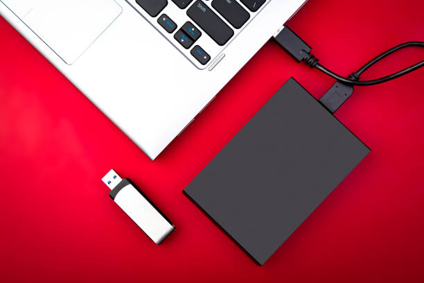 istock A portable hdd connected to a laptop with usb flash drive 1212212122