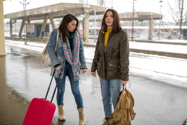 istock Two women Friends talk and laugh while traveling by train 1212213043