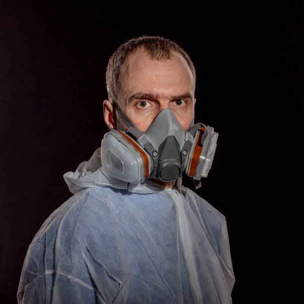 istock Respirator and protective eyewear on man face 1212214215