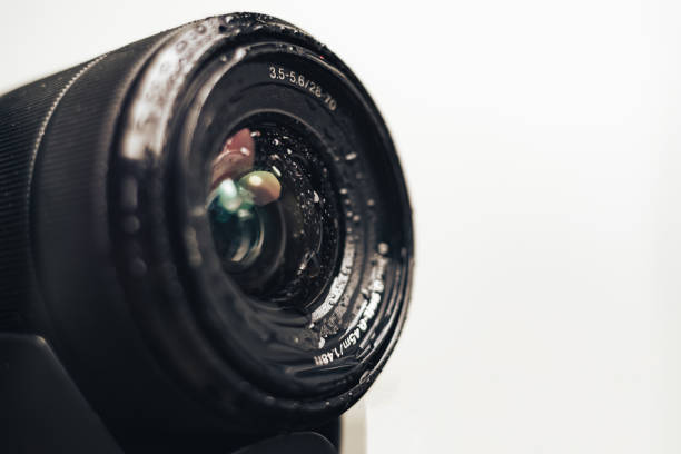 istock Close up beautiful Camera lens of drop water, on a white Background pattern for design. 1212216135
