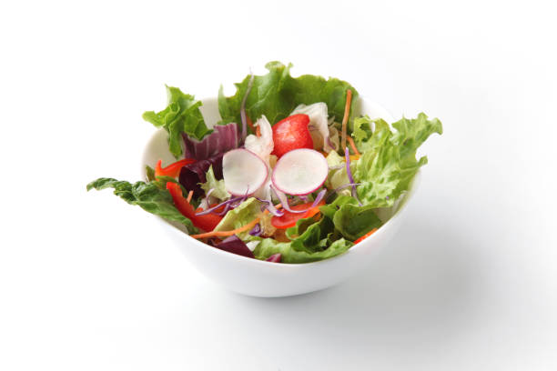 istock fresh green salad in bowl isolated on white background 1212218765