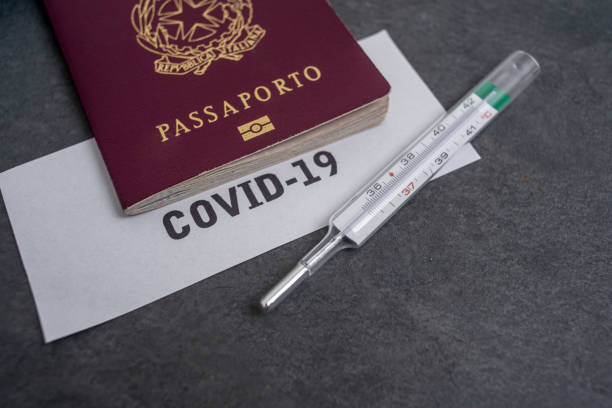 istock Coronavirus and travel concept. Note COVID-19 and  passport. 1212220170