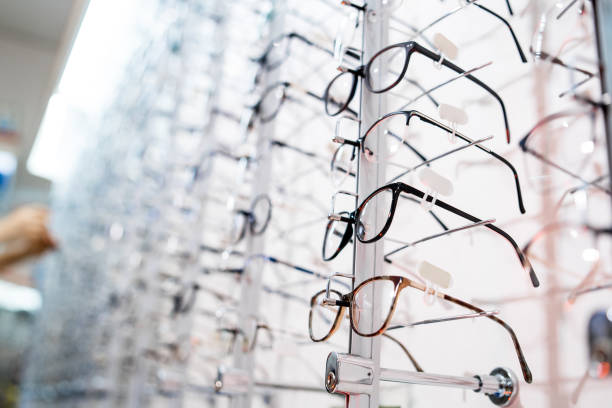 istock Image of a glasses showcase in a modern optic shop, selective focus. 1212220312