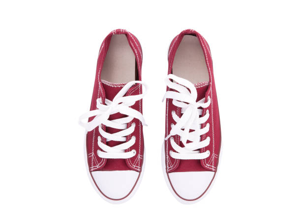 istock Red sneakers top view isolated on white background 1212221326