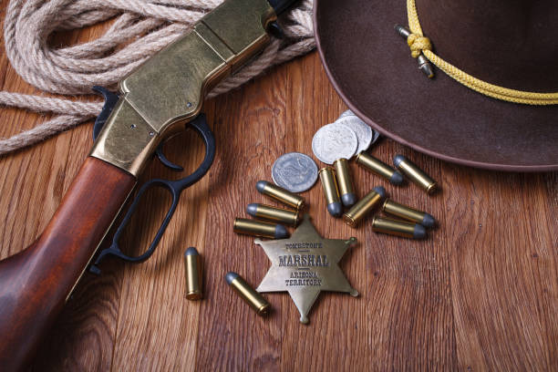 istock Wild west rifle, ammunition and sheriff badge 1212221664