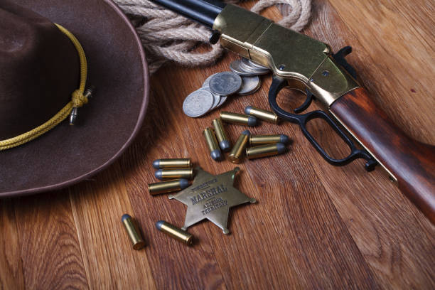 istock Wild west rifle, ammunition and sheriff badge 1212221676