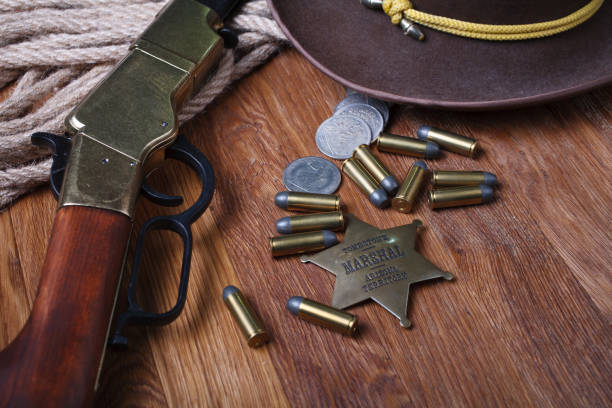 istock Wild west rifle, ammunition and sheriff badge 1212221690
