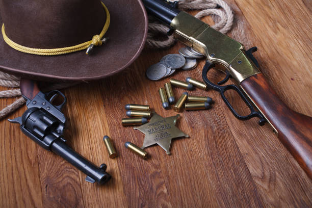 istock Wild west rifle, ammunition and sheriff badge 1212221705
