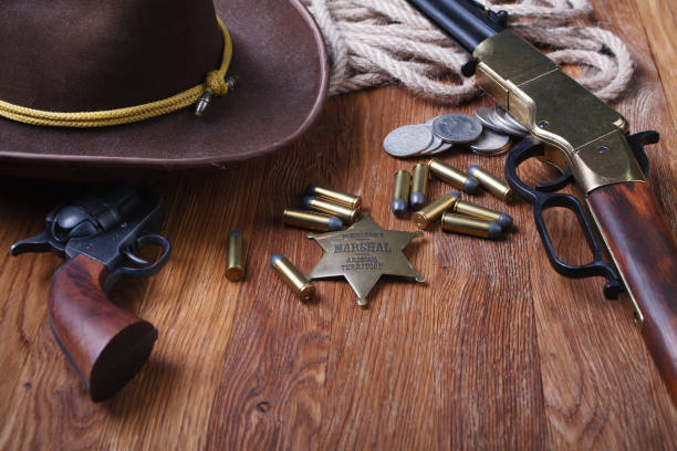 istock Wild west rifle, ammunition and sheriff badge 1212221859