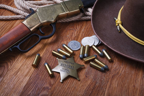 istock Wild west rifle, ammunition and sheriff badge 1212221882