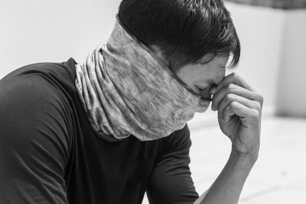 istock Sick man infected from a virus infection wearing a mask for protection. 1212224443
