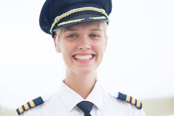 happy pilot working at the airport, portrait. transportation industry people. - cabin crew pilot airport walking imagens e fotografias de stock