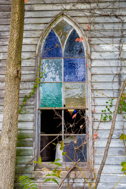 Old Broken Stained Glass Window On Abandoned Church