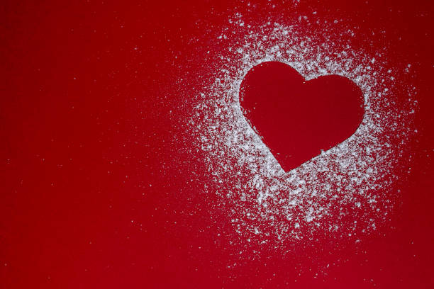 istock powdered sugar heart on red photo cardboard 1212227906