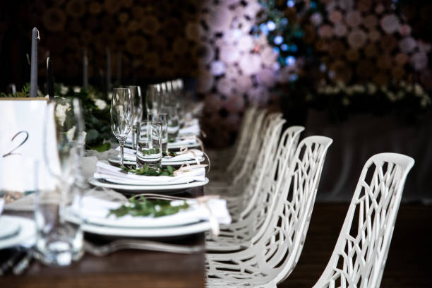 istock Festive table decorated with flowers and candles on a silver candlestick 1212228134