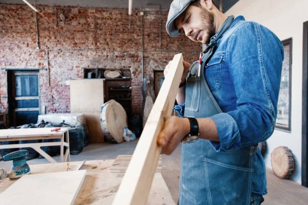 istock Successful handsome businessman with stylish cap work in carpentry 1212230502