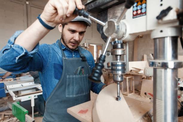 istock Successful handsome businessman with stylish cap work in carpentry 1212230514