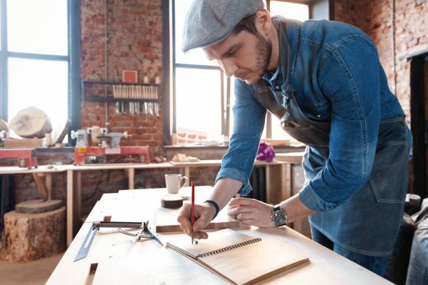 istock Successful handsome businessman with stylish cap work in carpentry 1212230516