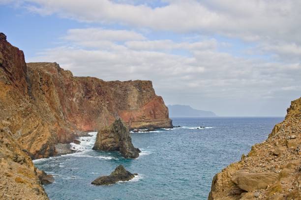 istock Landscape with cliffs and volcanic rock groynes in the atlantic ocean (Madeira, Portugal, Europe) 1212231099