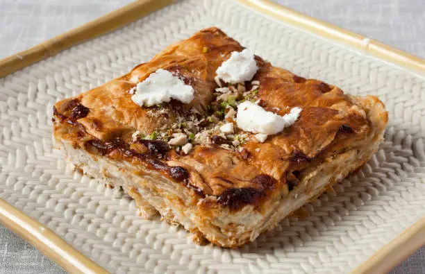 Photo of Close-up is Egypt's famous and traditional dessert Om Ali, Umm Ali or Oum Ali.