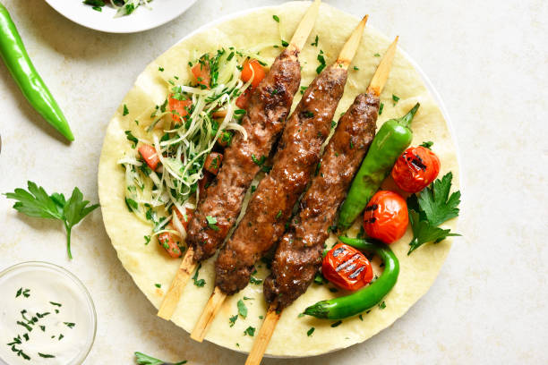 istock Turkish Adana Kebab with fresh vegetables 1212234486