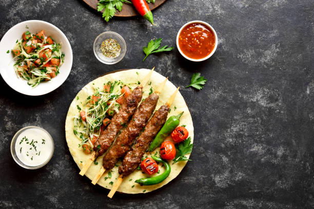 istock Turkish Adana Kebab with fresh vegetables 1212234487