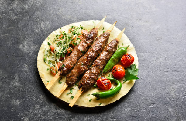 istock Turkish Adana Kebab with fresh vegetables 1212234503