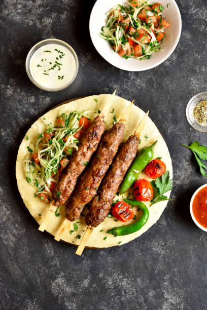istock Turkish Adana Kebab with fresh vegetables 1212234505