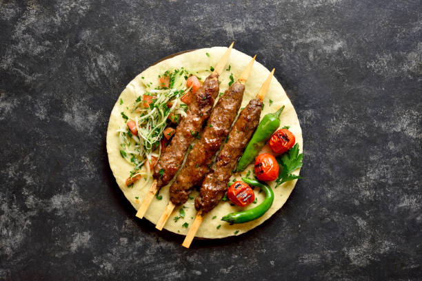 istock Turkish Adana Kebab with fresh vegetables 1212234512