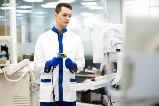 istock Handsome young scientist doing pathology blood test in lab 1212234723