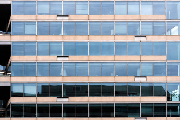 istock Glass office building facade with windows, texture, architecture - image 1212235289