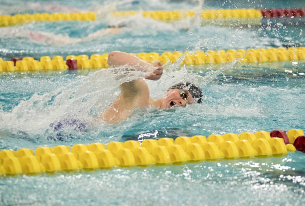 istock Young Man Swimming Freestyle 1212235350