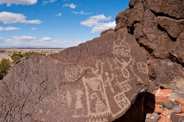 Nearly a thousand years ago natives inhabited the lower elevations around the San Francisco Peaks of Arizona.  In an area so dry it would seem impossible to live, they built pueblos, harvested rainwater, grew crops and raised families.  Today the remnants of their villages dot the landscape along with their other artifacts.  These petroglyphs were found on East Mesa in Wupatki National Monument near Flagstaff, Arizona, USA.
