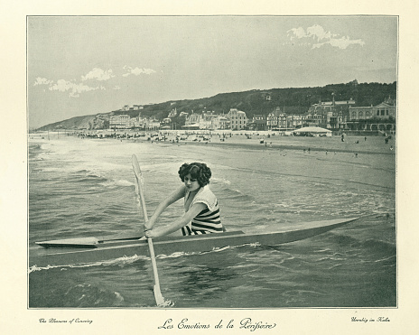 Vintage photograph of a Young woman canoeing in the sea, 19th Century