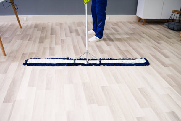istock Male Janitor Cleaning Floor In Office 1212236053