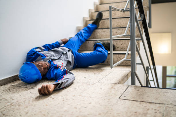 istock Handyman Lying On Staircase 1212236075