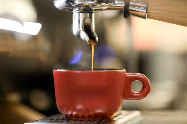 istock detail of espresso machine making coffee 1212236164