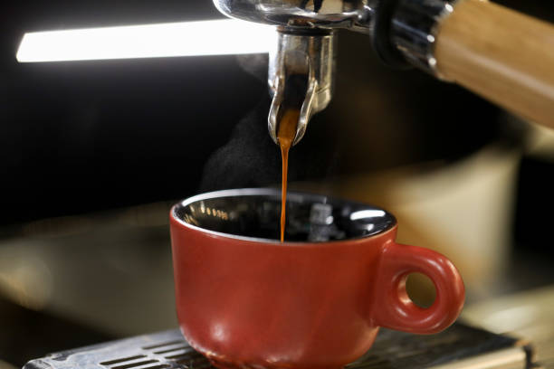 istock detail of espresso machine making coffee 1212236187