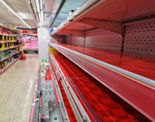 Empty shelf in grocery store concept coronavirus panic empty red shelf in a grocery store caused by coronavius panic sold out photos stock pictures, royalty-free photos & images