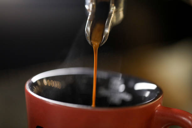 istock detail of espresso machine making coffee 1212236208
