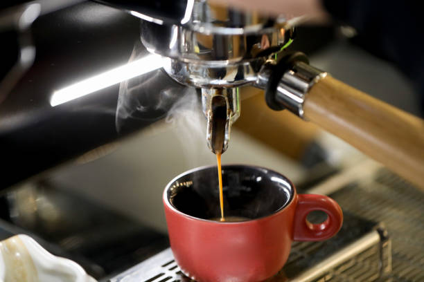 istock detail of espresso machine making coffee 1212236946