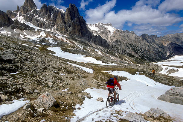 istock Biking downhill at a snowy trail,Dolomites, Italy 121223720