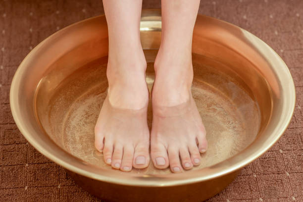 istock Female feet care in bowl. 1212237802