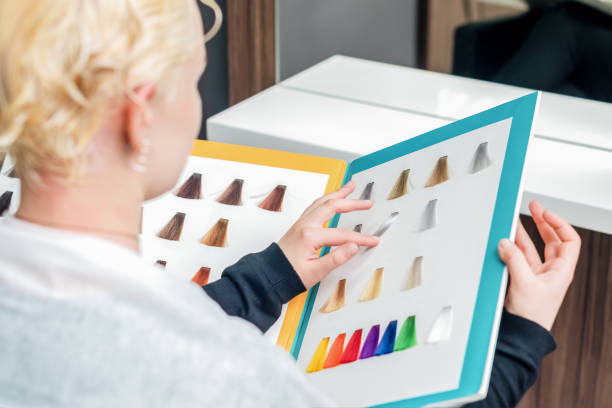 istock Woman selects hair color. 1212241791