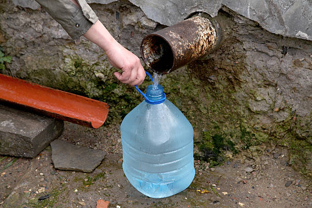 istock The female hand holds plastic bottle with water 121224213